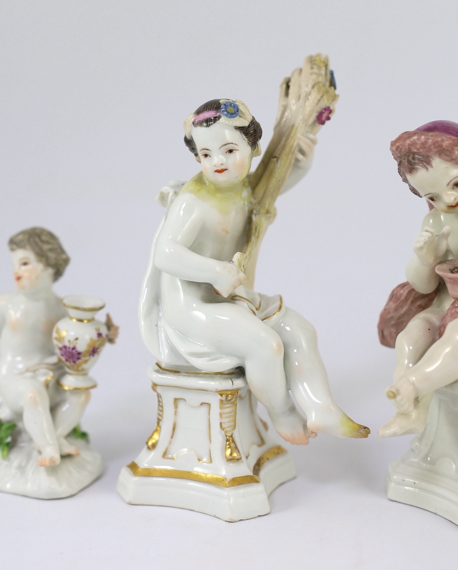Six Meissen porcelain figures of putti and a boy, second half 18th century, 8.5cm - 14.5cm high, restorations